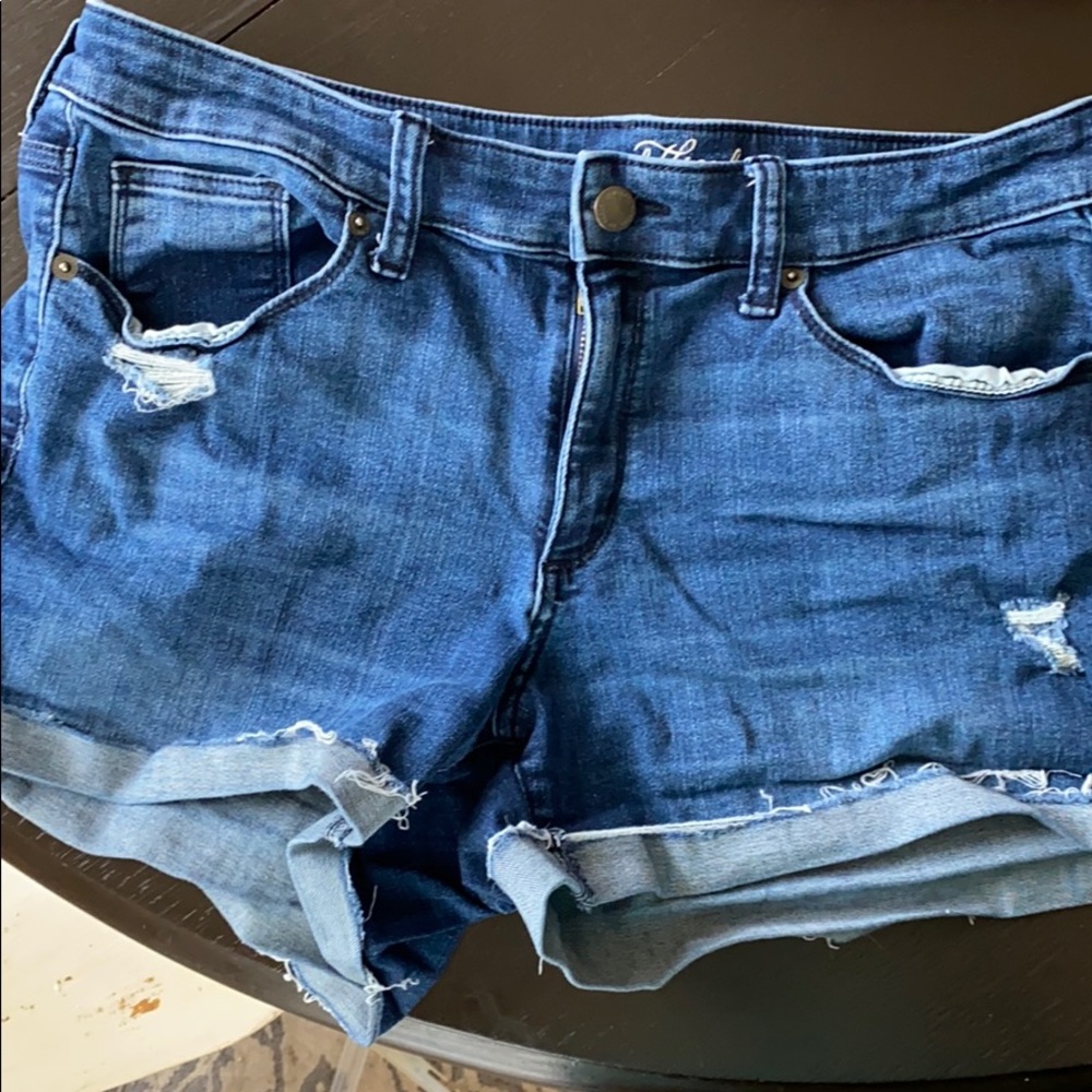 Lightly distressed jean shorts.